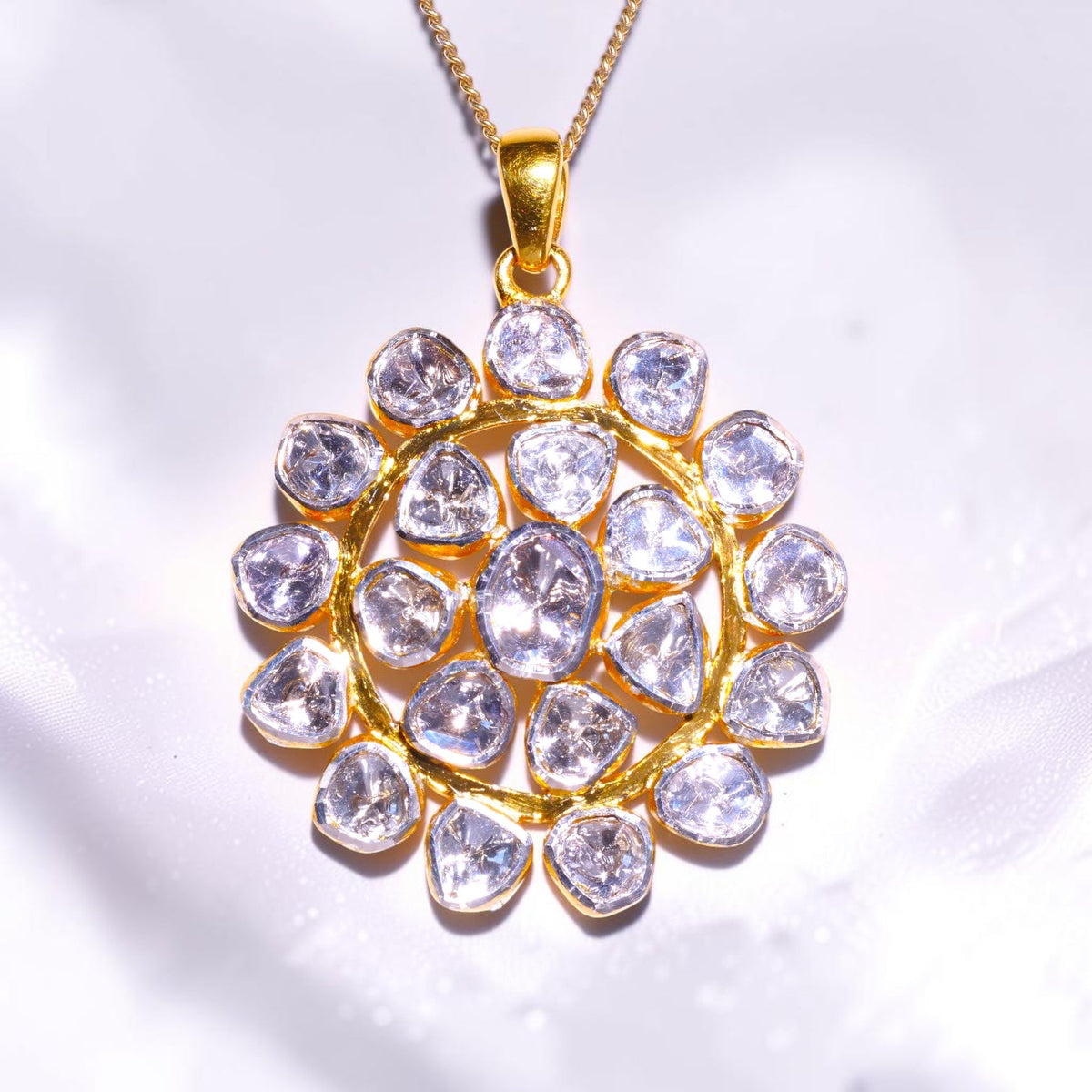 Gold pendant set with a cluster of uncut polki diamonds
