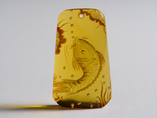 Yihen Natural Amber master carving 'Longmen Gate'. 35 x 20mm. 23.75 cts.