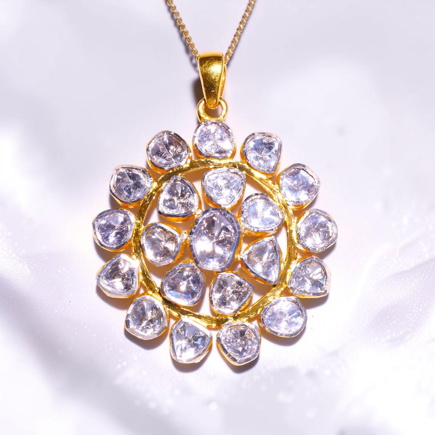 Gold pendant set with a cluster of uncut polki diamonds